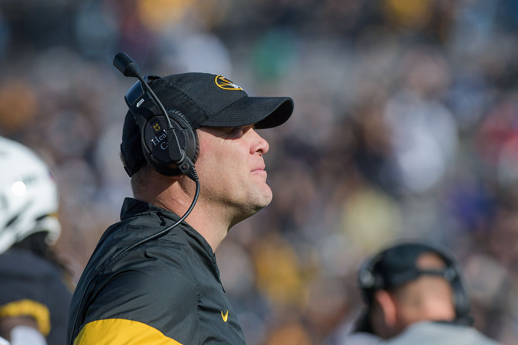 Barry Odom looks to the field